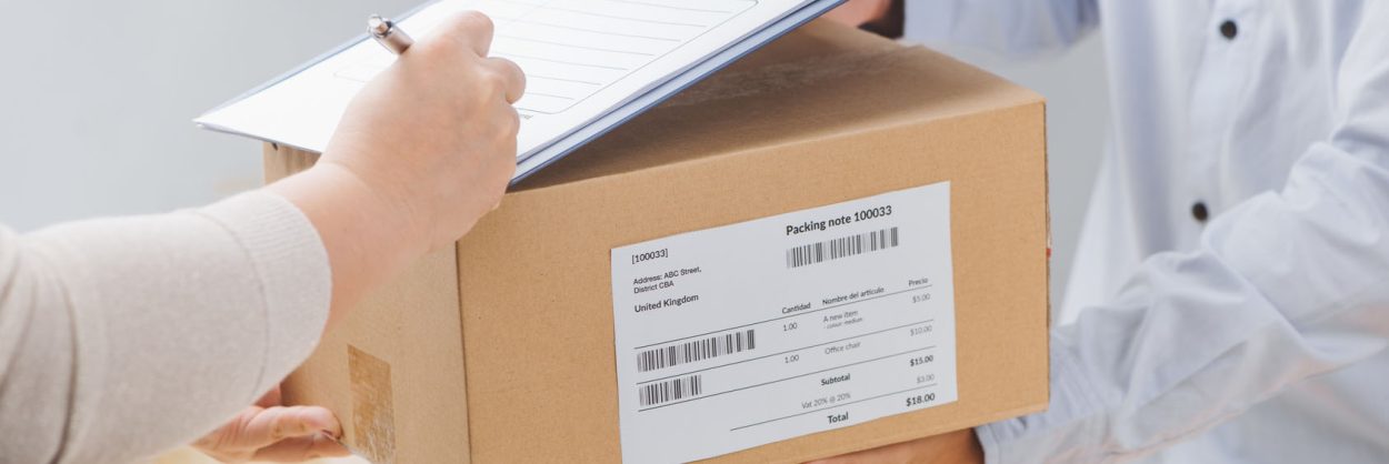 Woman signing receipt of delivery package, close up